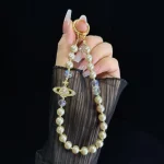 Alloy Saturn Crystal Pearl Phone Chain