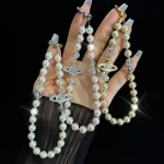 Alloy Saturn Crystal Pearl Phone Chain - Image 2