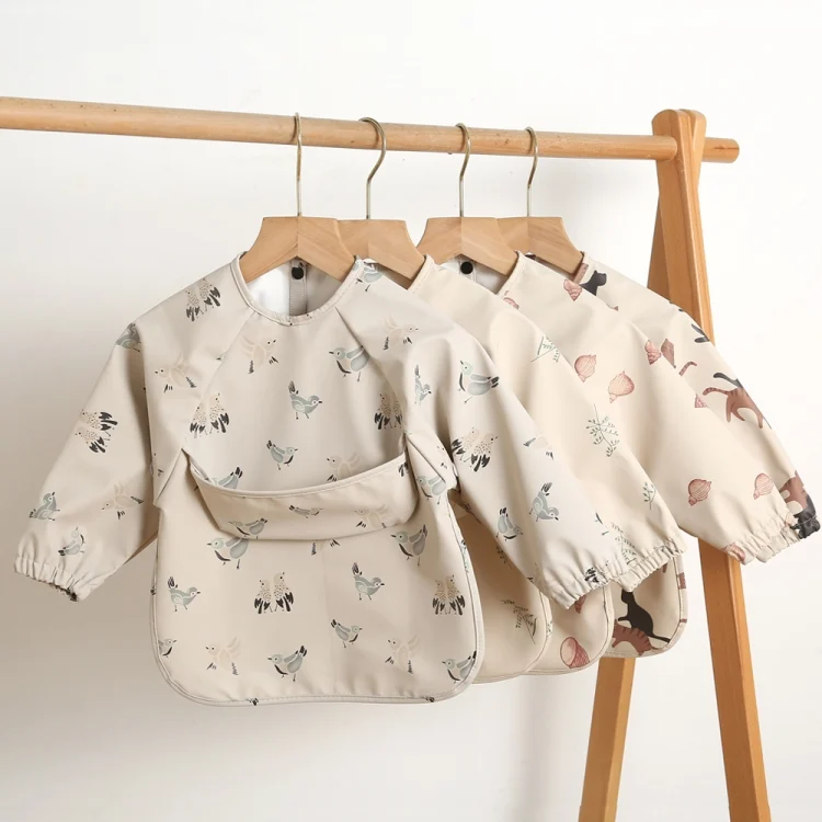TBD06043537_B1.webp Long Sleeved Baby Soft PU Bib Waterproof Washable Easy Clean Smock With Pocket - Image 2